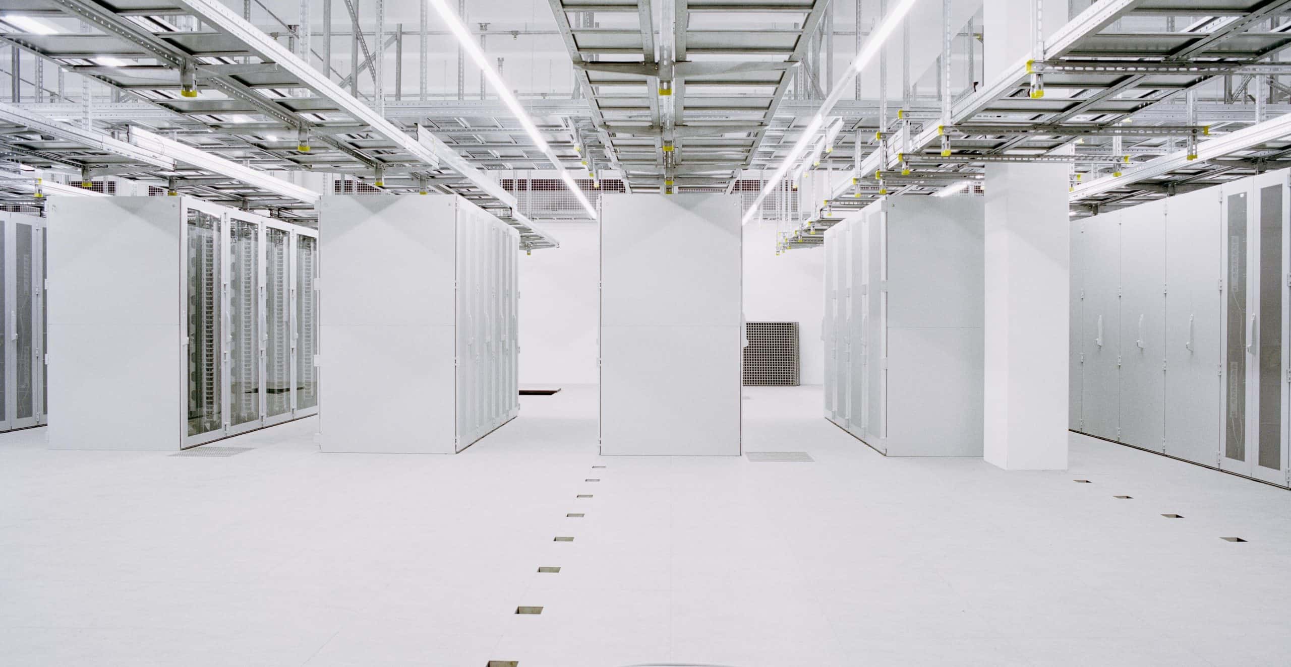 all white data center server room with racks